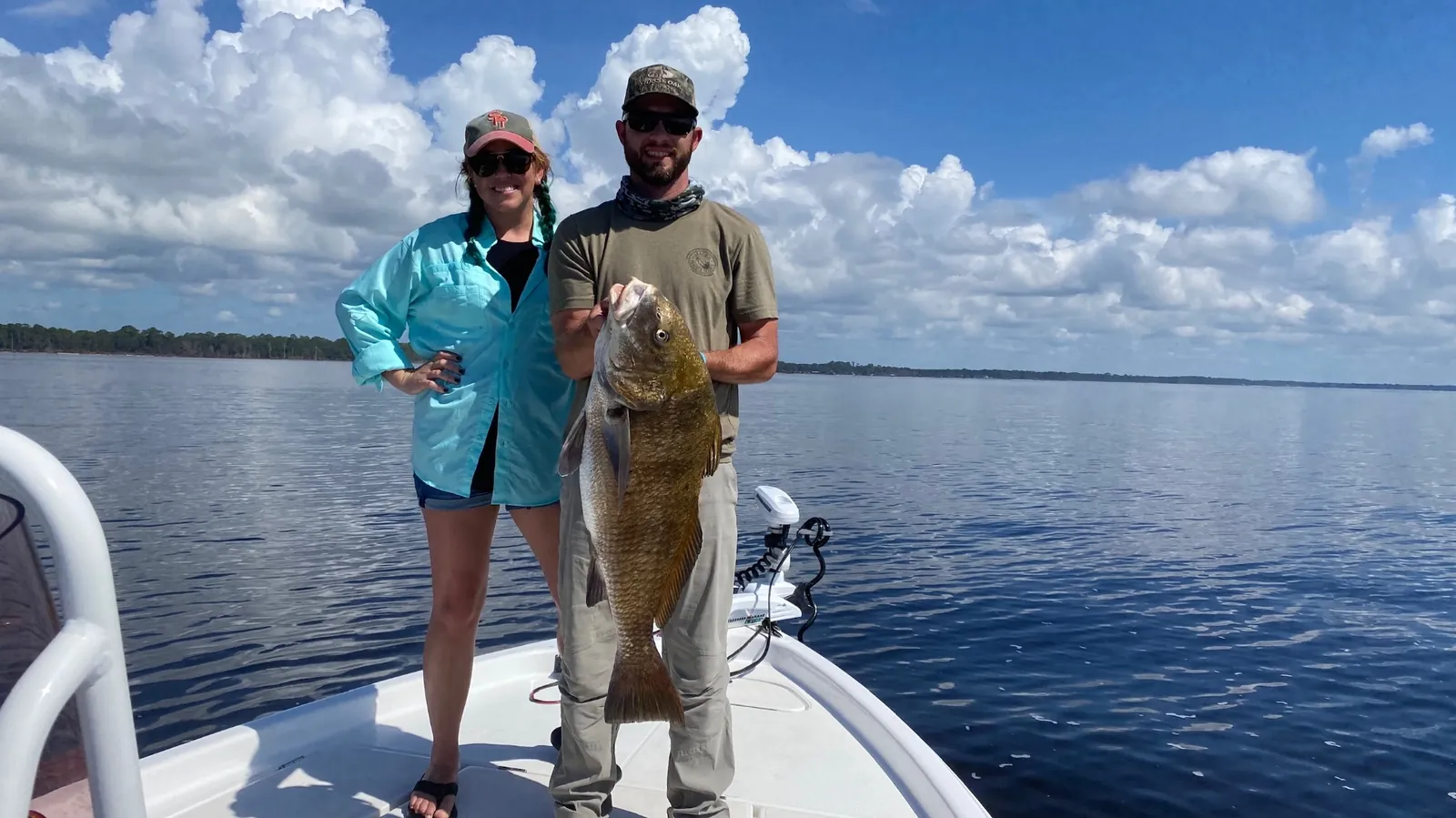 Couple with black drum catch on Choctawhatchee Bay
